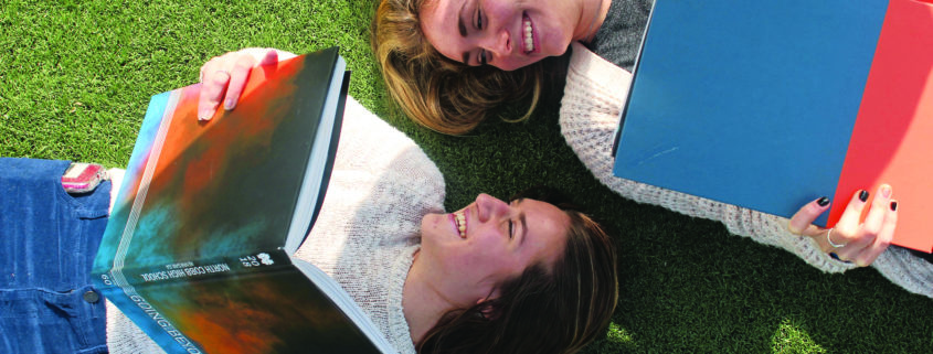girls-with-books-on-grass